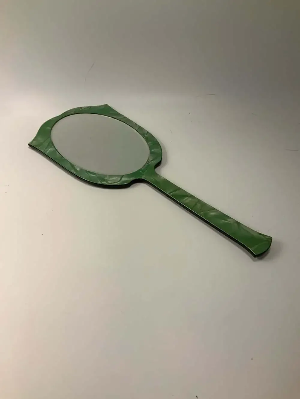 Vintage Art Deco Green Celluloid Hand Mirror With Floral Embossed Design